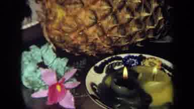 California USA (1971): Pineapple And Yellow And Green Candles And A Person With A
