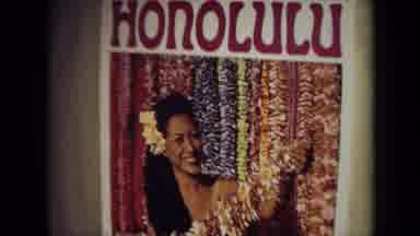 California USA (1971): Poster Reading 'Honolulu' And Woman Holding Leis Is Next To