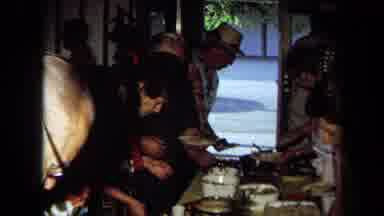 California USA (1971): Group Of People With Great Joy Serving Food To Share