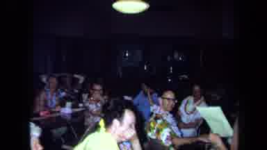 California USA (1971): A Gathering Of Adults At A Party With Many Tables