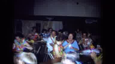California USA (1971): People Gathered For Party Celebration Rising Up From Seats