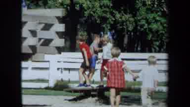 California USA (1971): A Group Of Kids Playing On A Homemade Piece Of Wood Toy
