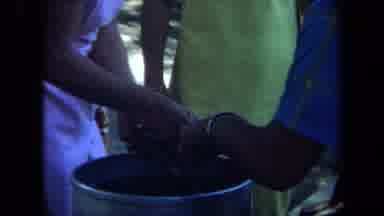 California USA (1971): People At Park Man Woman Rinsing Object In Bucket Of Water
