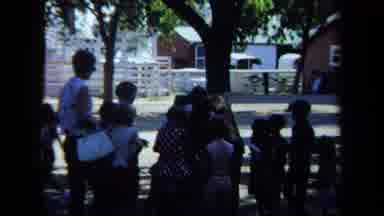 California USA (1971): A Group Of Kids With Their Teacher And One Of The Girls Is