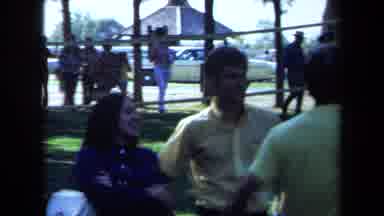 California USA (1971): Teenagers Hanging Out In The Shade And Waiting For Others