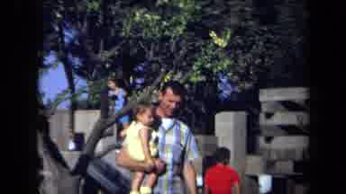 California USA (1971): The Walk Of Father And His Child Through The Park And