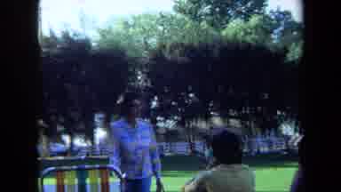 California USA (1971): An Old Woman In Park Sitting Down On A Chair