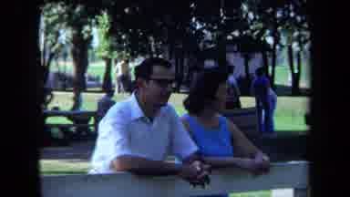 California USA (1971): Man Wearing Shades And Woman In Sleeveless Blue Blouse