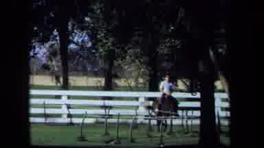 California USA (1971): A Person Is Riding On A Horse While The Horse Is Going To