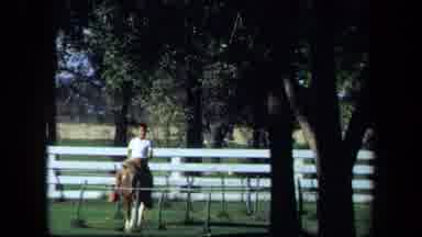 California USA (1971): Little Boy Riding A Pony Walking Towards Camera Then Turns