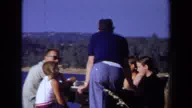 California USA (1971): A Group Of Family Members Having A Good Time At A Big