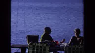 California USA (1971): Some People Having Food With A Lake And Some Speed Boats On