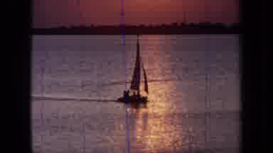 California USA (1971): Traveling On The Sea In A Small Sailboat At Sunset
