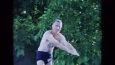 California USA (1971): A Man In A Speedo Trying To Dive Into A Pool Next To A