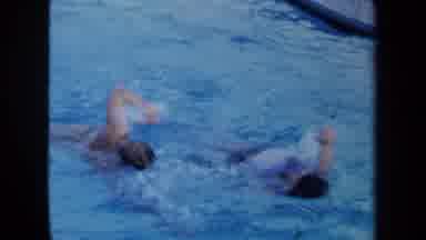 California USA (1971): People Swimming In A Pool