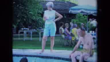 California USA (1971): Family And Friends Are Socializing Outside On The Pool Side