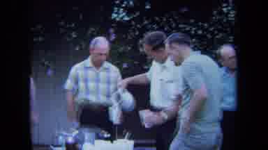 California USA-1971: A Group Of Men Enjoying A Pitcher Of Beer At An Outdoor
