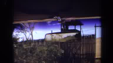 Laguna Hills California USA (1971): Car Driving By A Fied Then Through A Guarded