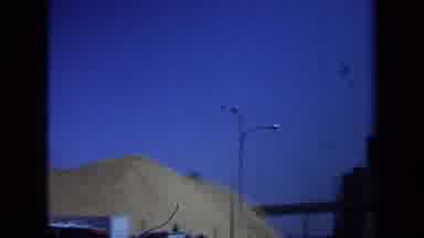 Maine USA (1971): A Tall Sand Pile With A Big Factory And A Conveyor Belt Going