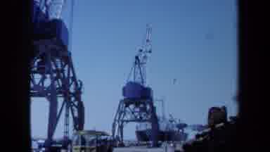 Maine USA (1971): Industrial Scene At Docks With A Vehicle Driving Down The Dock