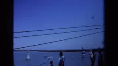 Maine USA (1971): People Are Walking Around Near The Beach And There Is A Sign