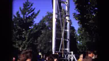 Sacramento California USA (1971): Man Up High Taking Pictures Above A Crowd Of