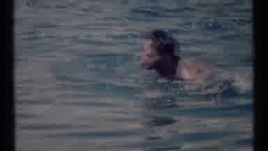 SCAPEGOAT WILDERNESS MONTANA USA .MP-1973: Dark Haired Man Swimming Breaststroke