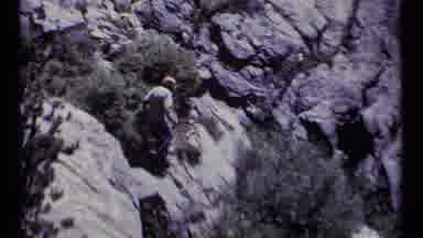 SCAPEGOAT WILDERNESS MONTANA USA .MP-1973: Man Hiking Up A Rock Face