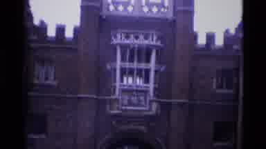 London England (1969): Giant Brown Building With Castle Features And Silver Bars