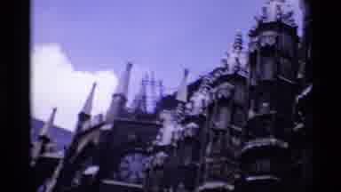 London England (1969): A Man's Face Appears In Front Of A Cathedral With Many