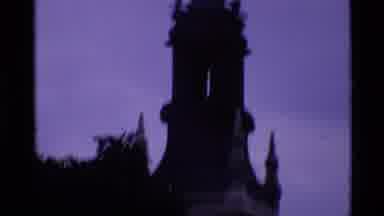London England (1969): Tourists Visiting An Area Near An Old Church With A Very