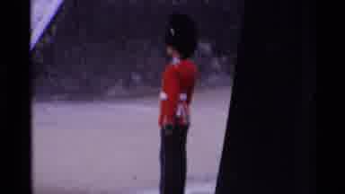 London England (1969): A Choppy Video Of A Guard With A Red Suit And A Black Hat