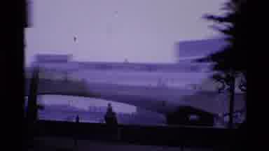 London England (1969): A Bridge With Water Under It Near Buildings