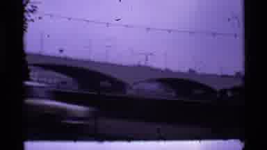London England (1969): Still Of Modern Bridge With Arches And A Moving Car In The