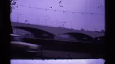 London England (1969): Bridge With Cars Filmed In The Afternoon Showing City