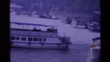 London England (1969): A Large White Boat Passing Under An Overhead Bridge On A
