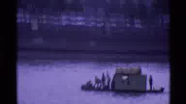 London England (1969): Men Out In The Middle Of The River On A Makeshift Boat