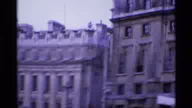 London England (1969): A Double-Decker Bus Is Shown Near A Historic-Looking Statue