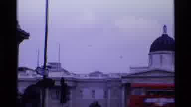 London England (1969): Swatch Of Birds Flying Sporadically Around A Large Mansion