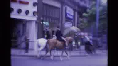 London England (1969): Two Uniformed Men Riding Horses On A Very Busy City Street