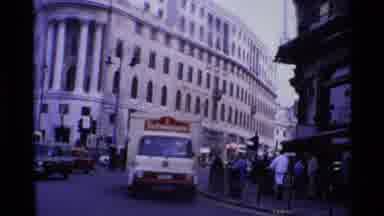 London England (1969): Delivery Truck Turns Corner Into An Area Where There Are