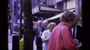 London England (1969): A Crowd Of People On A Street Corner Talking To Each Other