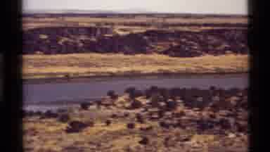 Holland Lake Montana USA (1972): Camera Follows Winding River With Greenish Brown