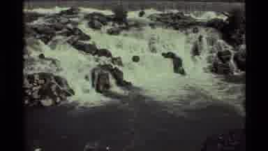 Holland Lake Montana USA (1972): Slowly Zooming In On Waterfall Over Rocks In A