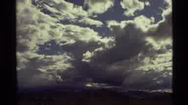 Holland Lake Montana USA (1972): A Light Blue Sky Obscured By Many White And Gray