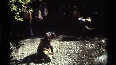 Holland Lake Montana USA (1972): People Walking In Nature Stop At River Spring