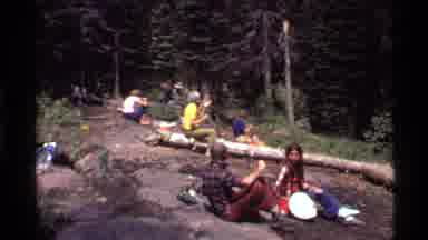 Holland Lake Montana USA (1972): Young Adults Camping In The Woods Nearby A Limpid