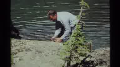 Holland Lake Montana USA (1972): Man Catches A Fish With His Bare Hands