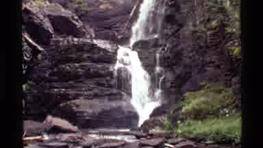 Holland Lake Montana USA (1972): Turbulent Small Waterfall Down Rocky Side Of