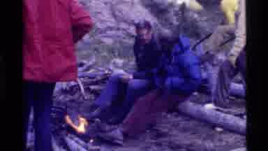 Holland Lake Montana USA (1972): A Group Of Friends Chat By A Campfire While Other